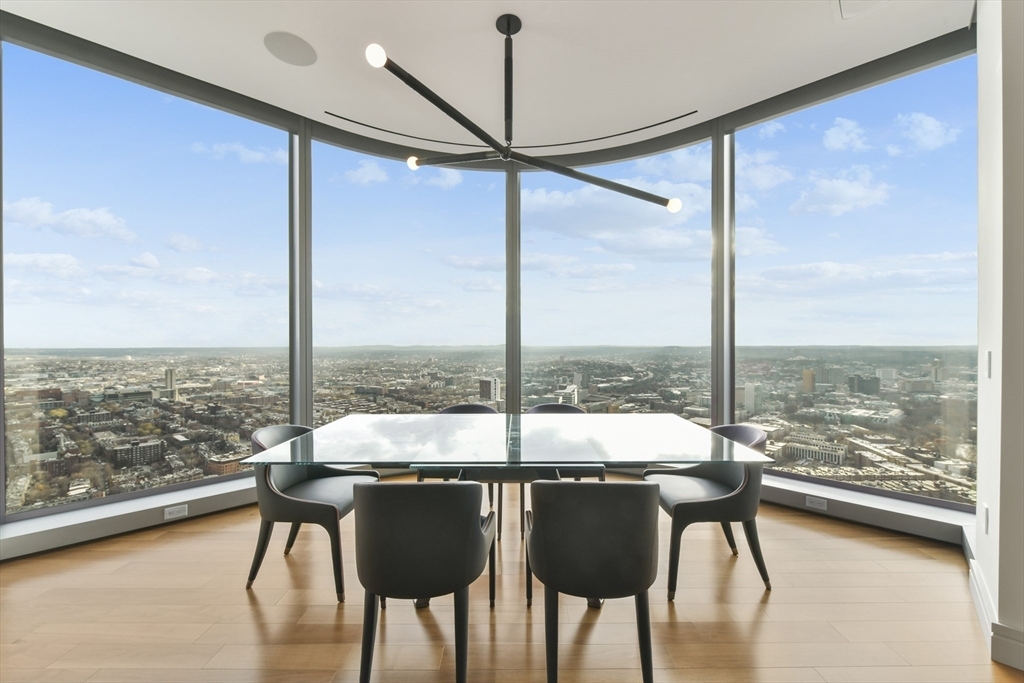 Spectacular Four Seasons Hotel One Dalton Street Boston residence! This corner home has been fully customized by the The Lagasse Group and offers exceptional upgrades, including custom built-ins. Every room features a Lutron Ketra lighting system and comprehensive audio/visual system with Bowers & Wilkins theater-grade sound, automatic shades throughout, integrated Control4 home automation, and audio even in the private elevator. This 3-bedroom, 3.5-bath residence showcases stunning views of Boston Harbor, the Blue Hills, Fenway Park, and the Charles River. The open living space includes a separate dining area, spacious living room with marble mantle and gas fireplace, and a chef’s kitchen with breakfast bar and top-of-the-line appliances. The primary suite offers abundant storage and a 5-piece marble bath. Residents enjoy 24-hour hotel services, spa, heated pool, fitness center, private club, and 2 garage parking spaces.