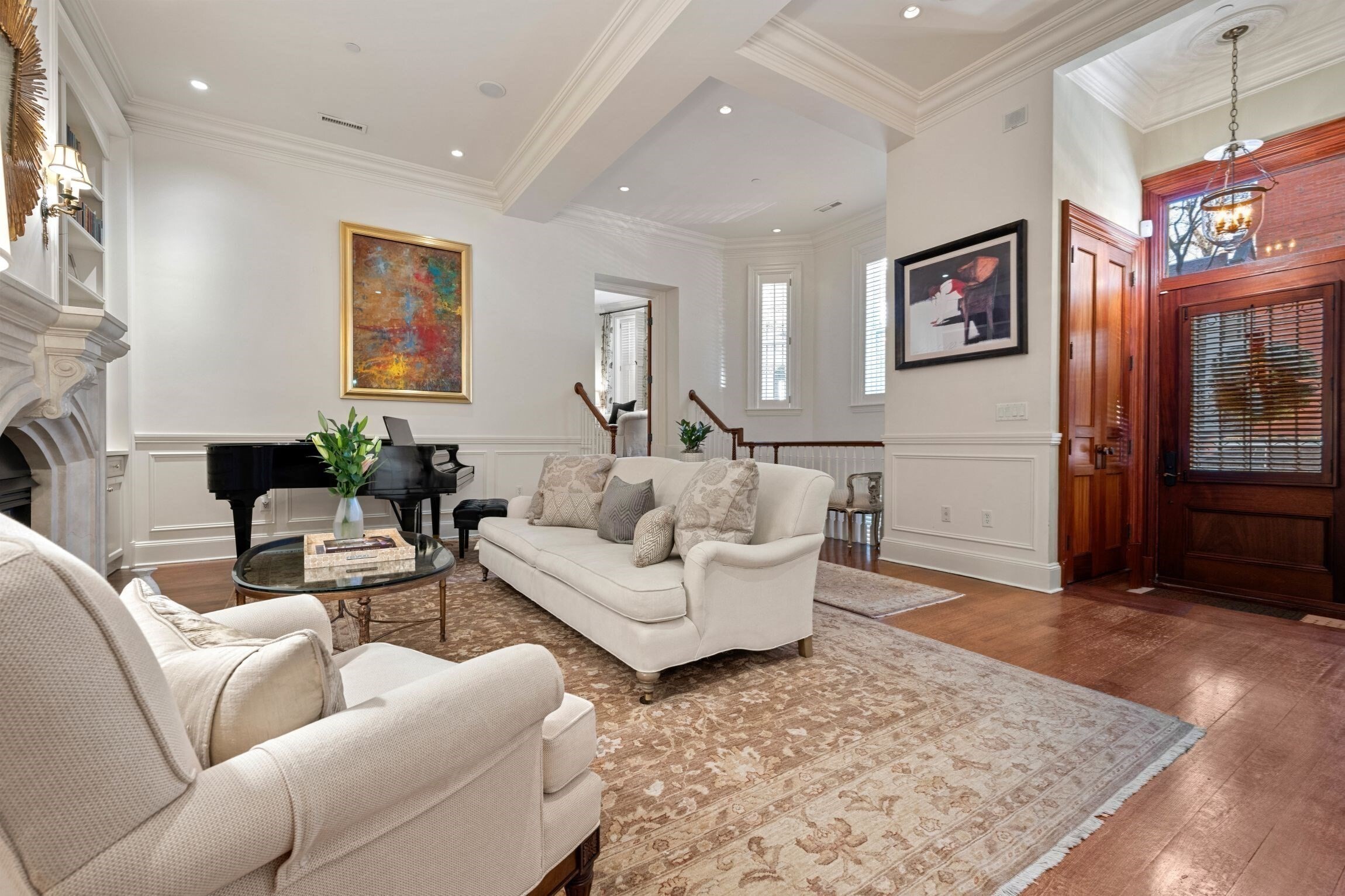 Truly incredible offering! This elegant property with 17(!) windows on the parlor level alone, offers a private townhouse-style entrance on picturesque Spruce Street, grand spaces and 3+ bedrooms. The rooms welcome you upon entry with their allure and volume. Guests will be in awe of the expansive living and dining spaces w/ 12 foot ceilings - unique, rarely seen architecture and scale. Beautiful millwork, a gas fireplace & warm hardwood flooring all add to this graceful space. Standout features include a handsome library/home office w/ wood paneled walls-a distinguished setting. A wonderfully laid out, oversized kitchen w/ notable appliances and pantry is adjacent to a fantastic den allowing for casual dining & cozy entertaining options. A luxurious primary suite w/ seating area offers 2 walk-in closets and an opulent bathroom. Two addt'l large bedrooms w/ en suite baths, powder room, storage. Reference floorplan to view the exceptional layout of this spacious, one-of-a-kind property.