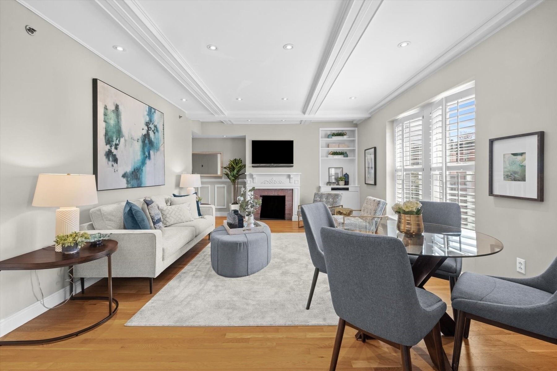 Enjoy quintessential Back Bay living in this sun-filled move-in-ready one-bedroom residence at the historic Barnes Mansion overlooking picturesque Marlborough Street. Rich in timeless character, this elegantly designed home features new Marvin wood windows, soaring coffered ceilings, hardwood floors, wainscoting, recessed lighting, custom French doors, custom built-ins & closets, plantation shutters & a handsome decorative fireplace. The kitchen offers granite countertops & stainless-steel appliances. Other highlights include central A/C, in-unit washer/dryer, abundant storage, & a private storage locker. This professionally managed boutique elevator building offers a grand formal lobby with period details, a historic fountain with original staircase, a beautifully landscaped common courtyard with patio seating, a Residents' Library, & a full-time superintendent. Moments from Newbury Street, the Comm Ave Mall, Charles River Esplanade, fine dining, shopping & cultural attractions.