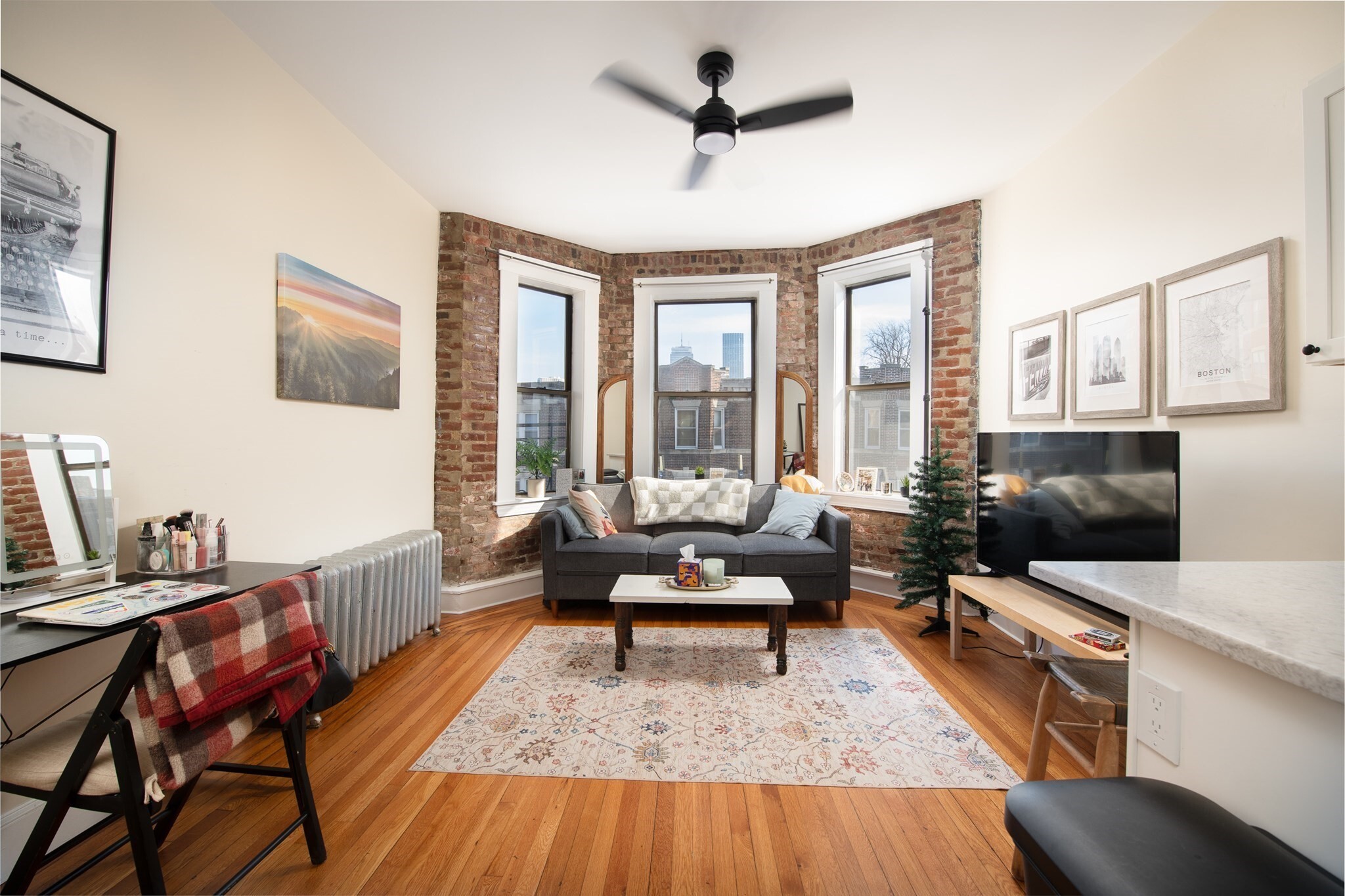 Contemporary and stylish one bedroom in the heart of Fenway! Located on the top floor of a great condo building, it makes the perfect starter home, pied-a-terre, or investment condo! Featuring a newly renovated kitchen with breakfast bar and stainless steel appliances, sun filled and front facing Bay windows with views of Prudential Tower and One Dalton, exposed brick, custom built in storage, high ceilings, hardwood floors, full tile bath, and more! Conveniently located in the middle of Fenway with quick access to Public transportation, Longwood Medical Area, Kenmore Sq, Copley Sq, Emerald Necklace, Colleges and Universities of The Fenway, grocery, restaurants, shops and cafes, and more! Professionally managed HOA with common laundry. Heat, Hot Water, Water / Sewer Included in HOA fee. Pet Friendly!