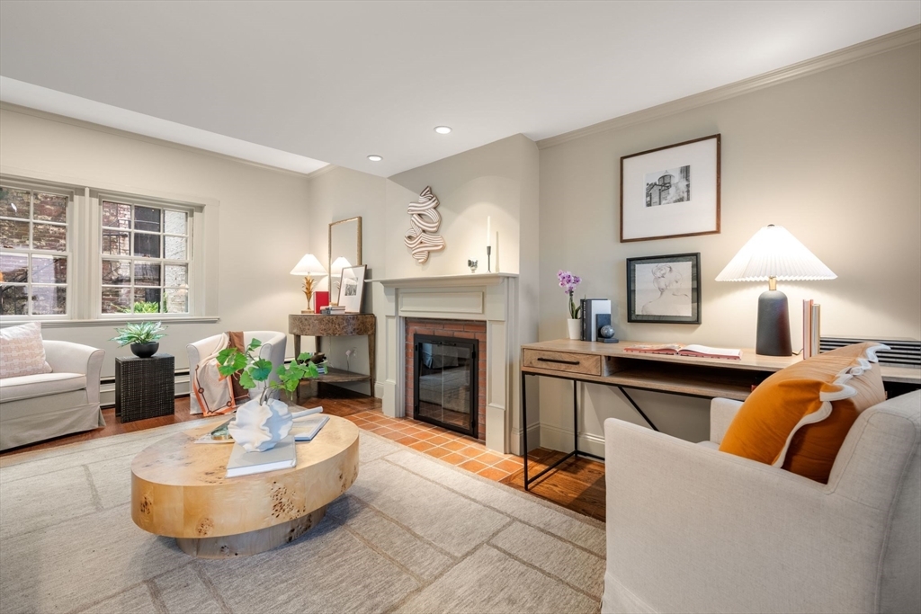 Just off iconic Chestnut Street, this exceptional Beacon Hill maisonette offers the rare combination of a private entrance, landscaped garden, and secluded patio in the coveted South Slope. Rich in architectural detail and filled with natural light from abundant windows and skylights, this elegant duplex lives like a private townhouse. The fireplaced living room opens to the private terrace, while the beautifully updated kitchen features stone countertops, custom cabinetry, and stainless appliances. A spacious den overlooking the garden provides an ideal home office or dining area. Upstairs are two generous skylit bedrooms, including a tranquil primary suite with large closets and a marble bath with radiant heated floors. Hardwood floors, Miele washer/dryer, air conditioning, and deeded storage complete this rare offering, just moments from Boston Common, the Public Garden, the Charles River,Esplanade and all and restaurants along nearby Charles St and the Back Bay.