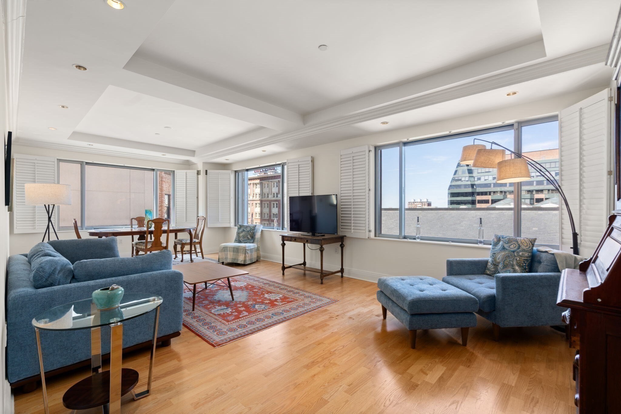Experience refined urban living at its finest at Trinity Place, an esteemed full-service residence in the heart of Copley Square. Corner unit bathed in natural light, with expansive windows framing iconic city views. Open-concept living & dining area is graced with wood floors, creating an effortless sense of sophistication & warmth. Thoughtfully designed kitchen features polished countertops, marble flooring, & premium stainless steel appliances. Open layout perfectly suited for everyday living & elegant entertaining. The serene primary suite is a true retreat, offering generous proportions, dual custom closets, & marble-clad bath with double vanity, walk-in shower, & linen storage. A second king-sized bedroom provides flexible space for guests or a well-appointed home office. Enjoy 24-hour concierge, on-site management, valet parking, renovated fitness center/spa, & in-residence dining from acclaimed Sorellina. A rare opportunity to live in one of Back Bay’s most coveted addresses. Rented through 7/31/27