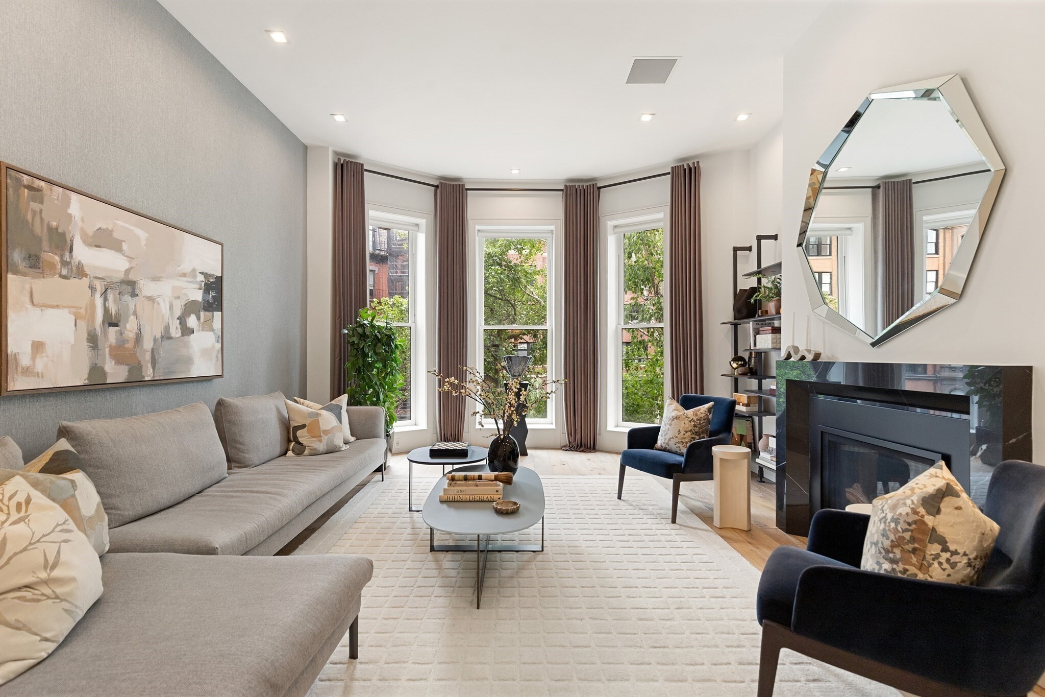 Second Floor Triplex on the first block of the sunny side of Marlborough Street and just steps from the iconic Boston Public Garden, this newly renovated 3 Bedrooms plus a home office (or 4th bedroom), 3.5 bath offers the perfect blend of luxury and smart design. Direct elevator access opens to the grand stair-cased foyer on the 2nd floor w/sunlit front-facing living room, soaring ceilings, and floor-to-ceiling windows. An elegant powder room and custom designed eat in Siematic kitchen with top-tier appliances and wide plank wood floors. The parlor level features a spacious primary suite with a European-designed custom closet system, a full Duravit bath with laundry, and a home office/bed with a gas fireplace. The guest level offers two additional spacious bedroom suites and access to small garden patio. A complete renovation introducing radiant heated floors throughout, integrated smart home features, hidden speakers, and raised ceilings on every level during renovation. 2 Parking (Tandem)