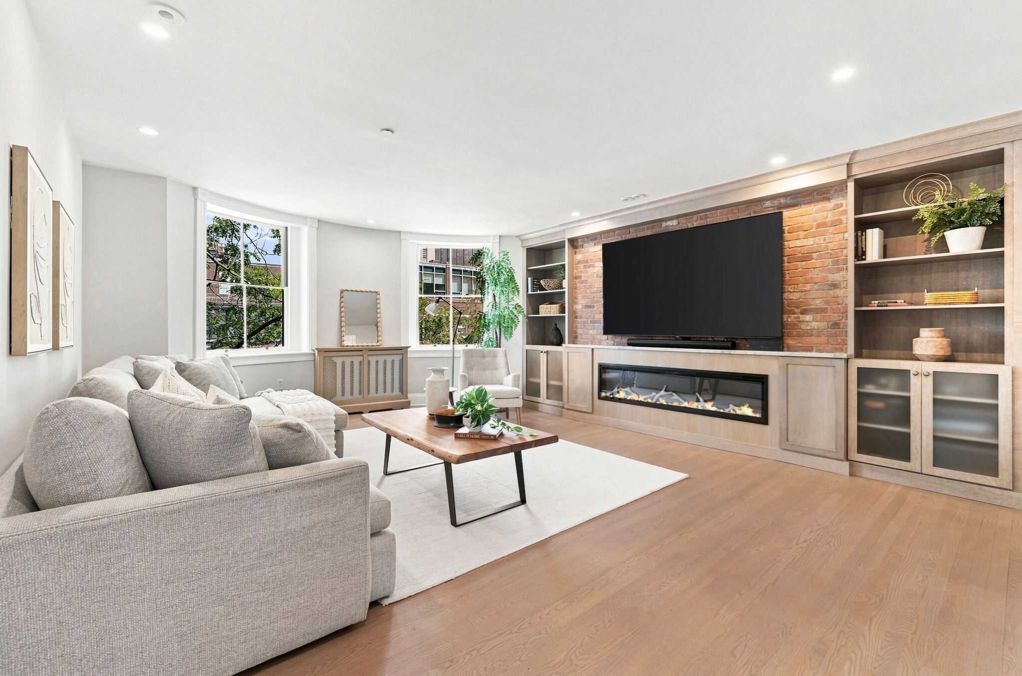 Perched above one of Boston’s most storied neighborhoods, this stunning penthouse duplex presents a rare opportunity to own a true home in the sky in the heartbeat of Beacon Hill. Spanning 1,856 square feet with three bedrooms, a private office & two and a half baths, the residence was extensively renovated in 2020/2021, thoughtfully balancing the character and warmth of Beacon Hill with the comforts of modern living. Warm, European inspired details and custom finishes lend a distinctive sense of character throughout, while the thoughtfully designed layout creates the space, flow, and separation of a single family home. The main living level is designed for gathering and entertaining, with an open flow connecting the kitchen, dining, and living spaces. A Montigo fireplace with a built in entertainment area anchors the living room, while the beautifully appointed kitchen features custom cabinetry, Cristallo quartzite countertops, an ILVE range, and a custom designed statement hood. A private office with built in Murphy bed adds exceptional flexibility. The bedroom level offers a sense of privacy and retreat, highlighted by an expansive primary suite filled with natural light and complete with an ensuite bath and beautifully outfitted walk in closet. An additional upper level seating area leads to the private roof deck, where sweeping views of the Boston skyline and iconic Massachusetts State House create an unforgettable backdrop. A deeded basement storage unit and nearby garage rental parking further enhance the offering. Ideally situated within easy walking distance of Charles Street, MGH, Whole Foods, Government Center, and the Financial District, this exceptional penthouse offers effortless access to Beacon Hill’s renowned dining, cultural institutions, and green spaces capturing the character, warmth, and sophistication of Boston living at its best.