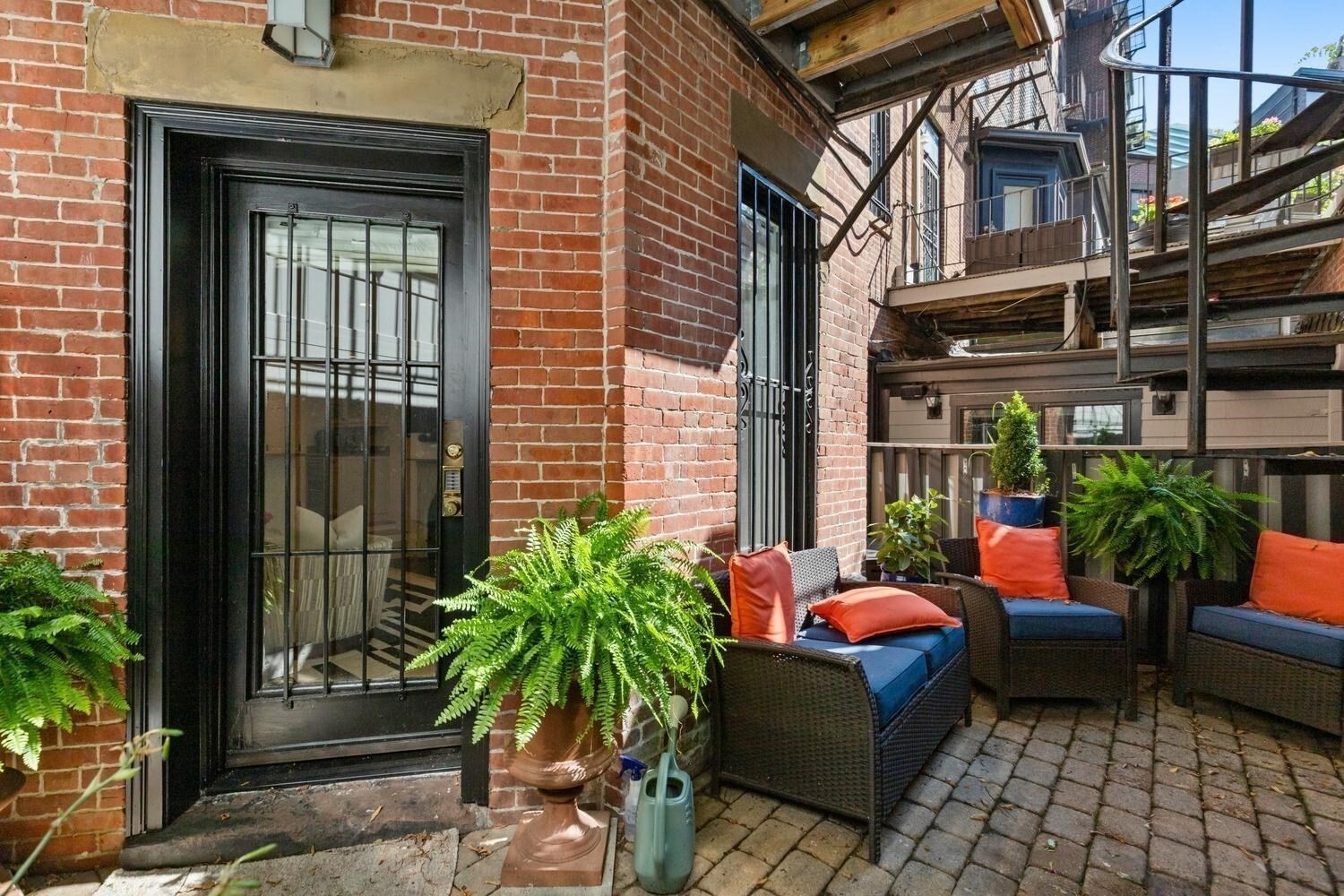 Garden level, exceptional Marlborough Street location in the heart of Boston’s Back Bay, two blocks from the Boston Public Garden, Charles River Esplanade and Newbury Street. Ideally situated between Clarendon and Berkeley Streets. Thoughtfully designed to maximize space, this charming Garden residence offers two generously sized bedrooms, 2 full bathrooms, and your own serene private outdoor space. The spacious primary suite comfortably accommodates a king-size bed and features an additional office/nursery, custom closets, and an en-suite bath with an extra-deep soaking tub. The versatile second bedroom accommodates a queen-size bed. The spacious open kitchen offers abundant counter space with bar seating, a separate dining area, and a built-in bar with a dual-zone wine refrigerator, creating an inviting setting for both everyday living and gracious entertaining. Additional highlights include an original decorative fireplace mantel, exposed brick, IN-UNIT LAUNDRY, Central AC, and PRIVATE OUTDOOR SPACE with convenient alley access, ideal for groceries, strollers, or easy mobility. Perfectly positioned to enjoy the best of Back Bay, the home is moments from premier shopping, dining, and neighborhood amenities, with the Boston Public Garden and Charles River Esplanade just a short stroll away. Professionally managed building with garage parking options nearby.