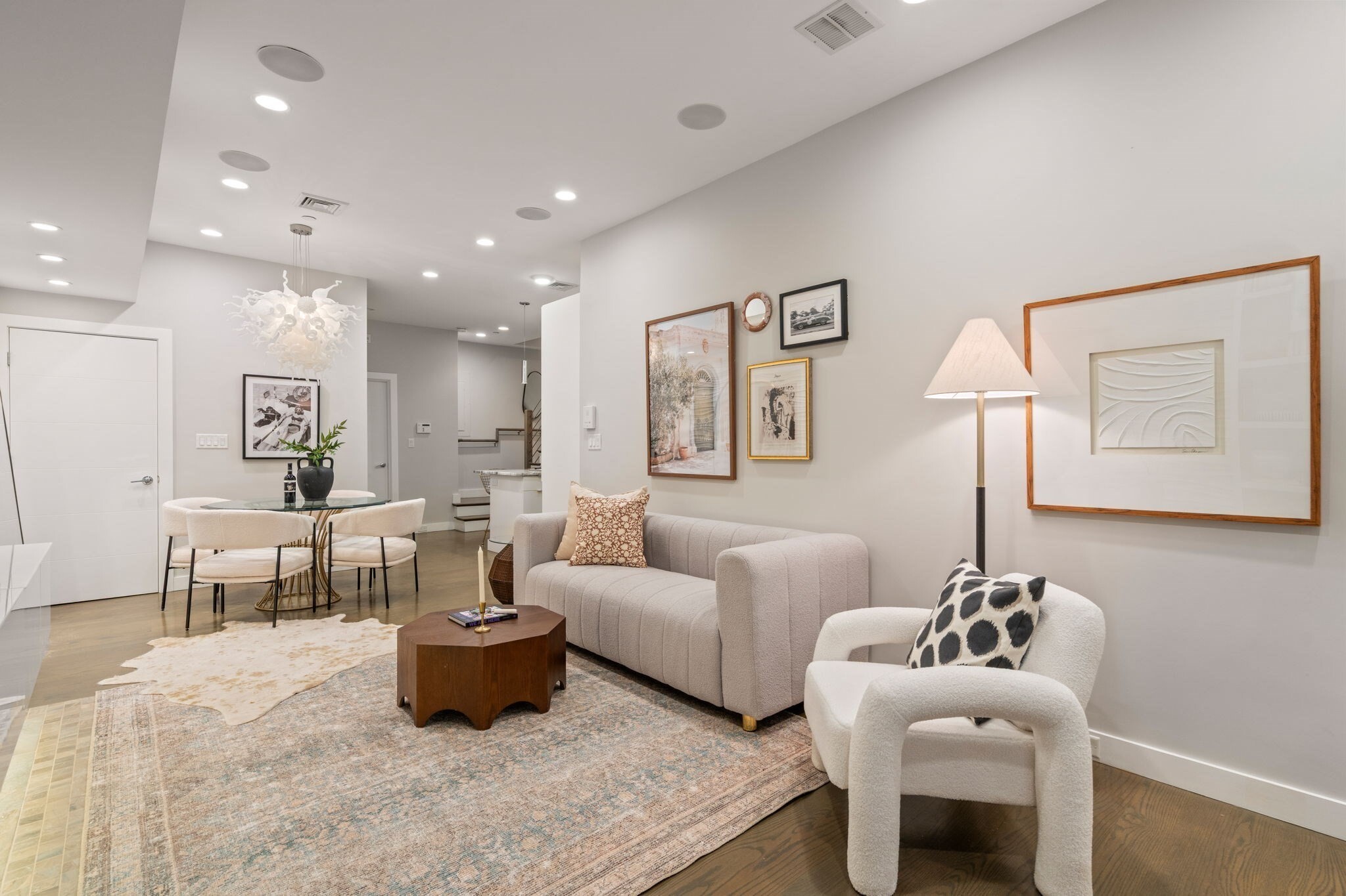 This generously proportioned one-bedroom residence is ideally situated on the sunny side of Marlborough Street, offering direct-access parking in a fully owner-occupied 5-unit luxury development. The sophisticated home was created as part of a 2014 gut renovation of a double-width building, seamlessly blending contemporary design with exceptional functionality. Unit features include white oak flooring with a refined, gray-stained finish, 9-foot ceilings, central A/C, recessed lighting, in-unit laundry and abundant storage. The open kitchen is beautifully appointed with granite countertops and seating for two, custom white cabinetry, open stainless-steel shelving, and a suite of high-end appliances, including a Thermador 4-burner gas cooktop, ASKO dishwasher, Fisher & Paykel refrigerator and U-Line wine fridge. The spacious bedroom offers 2 closets, new wall-to-wall carpeting and a luxurious en-suite bath finished with a marble tiled steam shower, heated towel bar and radiant heated floors. The living room is anchored by a striking modern gas fireplace and framed by a sculptural white-tile wave wall, creating a dramatic and distinctive architectural focal point. The residence may be accessed through the building’s elegant marble entry foyer or via a private rear entrance directly from the parking area. Additional highlights include exclusive use of a private section of the rear patio complete with a dedicated gas line for grilling. A rare combination, perfectly suited for the discerning buyer seeking a beautiful move-in ready home on one of Boston’s most coveted streets in one of its most sought-after neighborhoods.
