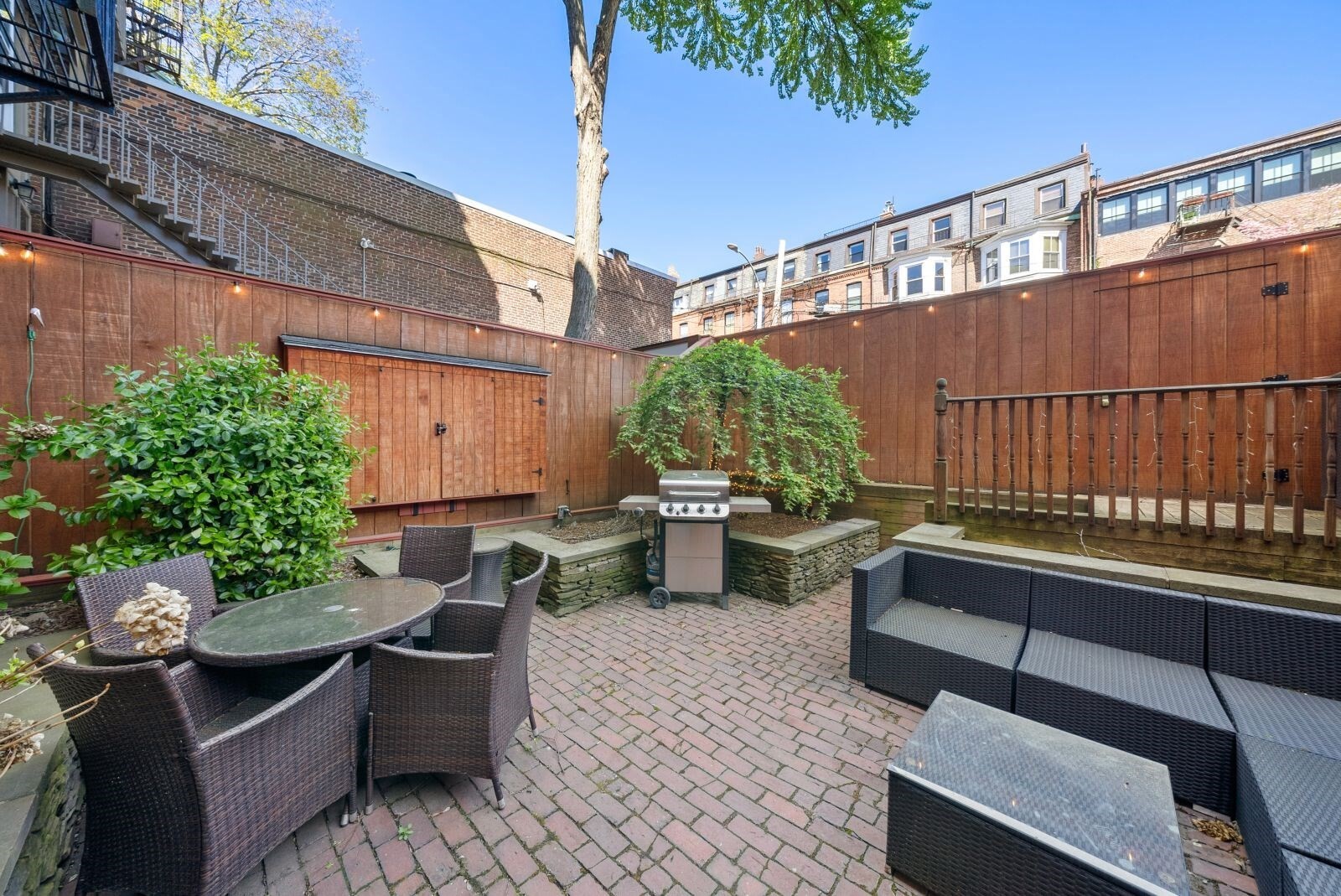 Live on the Sunny side of Marlborough Street! Enjoy easy city living in this pristine updated one bedroom garden level condominium which has a private entrance and a private 560 SF patio! The condo offers hardwood flooring throughout, A/C and a modern kitchen with granite countertops, stainless appliances and plenty of storage. The King sized bedroom boasts an 8'x10' built in storage area with a cozy nook for a desk or reading area. The large bathroom has been recently updated and includes radiant flooring. Enjoy entertaining on your private patio "Outdoor Room" which features an 85 inch TV, refrigerator, ice machine and grill; a terrific extension of your living space! Common laundry is located just outside the door and heat and hot water are included in the low HOA fee of $535 per month. Moments to the Esplanade, MBTA and all the trendy shops and posh restaurants on Newbury Street.  A perfect investment opportunity which has garnered solid rent or a darling Pied-A-Terre!