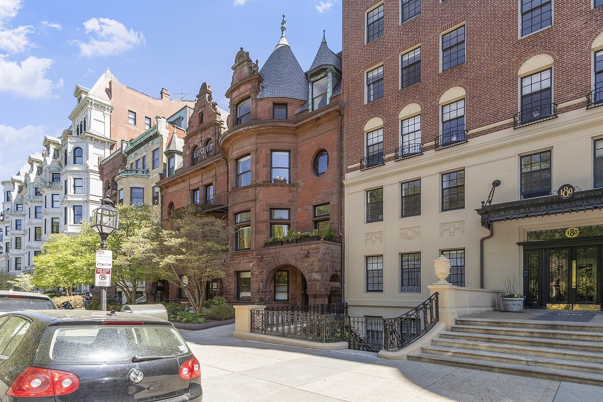 Historic Commonwealth Avenue Penthouse opportunity with private roof deck and one deeded parking space in rear of building. This duplex home that overlooks the Commonwealth Mall is located in a Romanesque style brownstone which has two bedrooms, two full spa like marble bathrooms, and an elegant front facing living and dining room with original detail fireplace, bay windows, and French doors to the kitchen with appliances by Sub Zero, Bosch and Thermador. The loft-like master bedroom with skylight encompasses the upper level and connects to a separate sitting area, large walk-in closet and full bath with stackable laundry. Modern amenities include recessed lighting, a wet bar, gas lines installed throughout the building, central A/C with newer compressor, and updated elegant common spaces all in a professionally managed association. A full staircase leading to roof deck offers wonderful views of tree-lined Commonwealth Avenue and the Back Bay skyline.