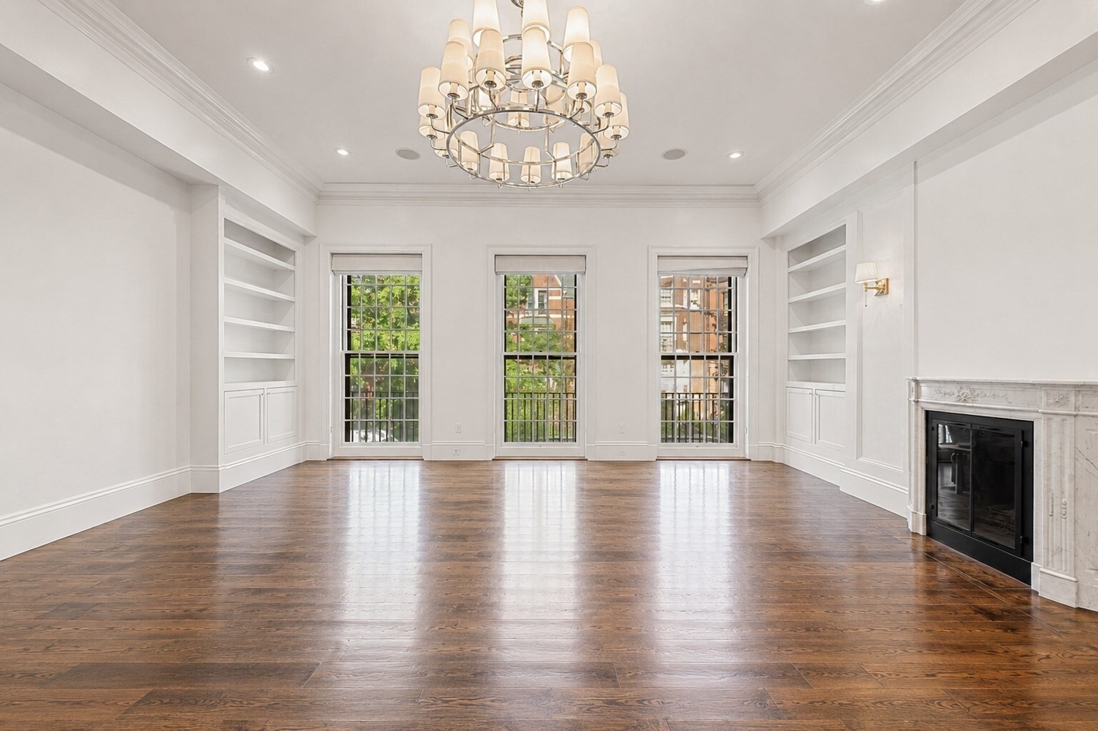4 bed, 4 bath, more than 4,000 square feet, and direct-access deeded parking distinguish this exceptional upper triplex in a historic Marlborough Street residence. The gracious main living level features a formal living room with dramatic floor-to-ceiling windows, a custom kitchen equipped with Wolf and Thermador appliances, a dining banquette, and an inviting formal family room with two fireplace's. Occupying an entire floor, the expansive primary suite offers exceptional privacy and includes a sitting room, a fireplace, walk-in closet, and a luxurious bath with a soaking tub, steam shower, and dual vanities. The upper level provides three additional bedrooms, (one could be a great office) a full bath, a dedicated laundry room, and generous storage. Crowning the residence is a private roof deck featuring new composite decking, sweeping views of the Boston skyline, and convenient access to water, gas, and electricity. Significant 2026 improvements include a new roof, re pointed rooftop brickwork, fresh paint throughout the common staircase from top to bottom, a renovated common entrance, a new intercom system, and professionally landscaped exterior areas. Additional highlights include a total of six gas fireplaces, artisan finishes, and direct-access deeded parking. Ideally situated in the heart of Back Bay, moments from the Quin House, Newbury Street, the Charles River Esplanade, and Boston’s leading universities