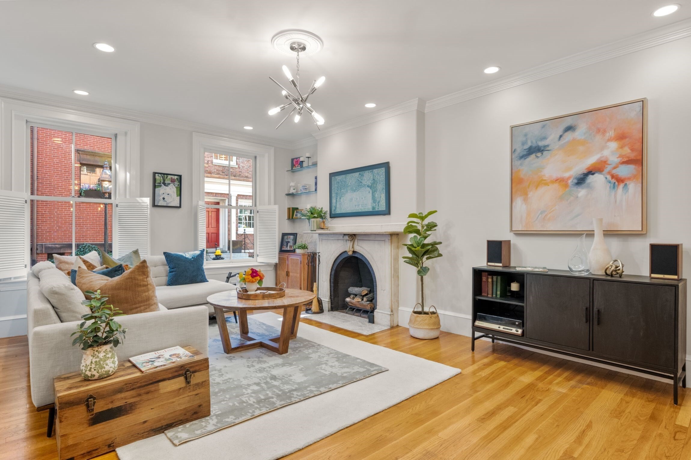 Situated on charming Pinckney Street, one of Beacon Hill's most desirable and welcoming locations, this 2 bedroom/1 bathroom condominium offers abundant sunlight, open-concept living spaces and a warmth that is hard to replicate. The front facing living/dining room and kitchen features large dimensions, a fireplace and beautiful hardwood flooring - a flexible space perfect for multiple seating arrangements. The kitchen has counter seating, fantastic large prep space and beautiful stone counters. A tastefully renovated bathroom with double sink, clawfoot tub and large shower is ideally situated near the bedrooms with laundry nearby. The primary bedroom is extra-special with a decorative tin ceiling, bright exposure due to a unique corner bump out, and is also extremely spacious with plenty of space to add a chair or desk. The primary also features a sensational (!) walk-in closet. The second bedroom is nicely sized with another delightful corner exposure and wonderful sunlight. A welcoming entry foyer, central air, in-unit washer dryer, basement storage, healthy reserve and high owner occupancy make this an incredible Beacon Hill offering. The Association is also pet-friendly.