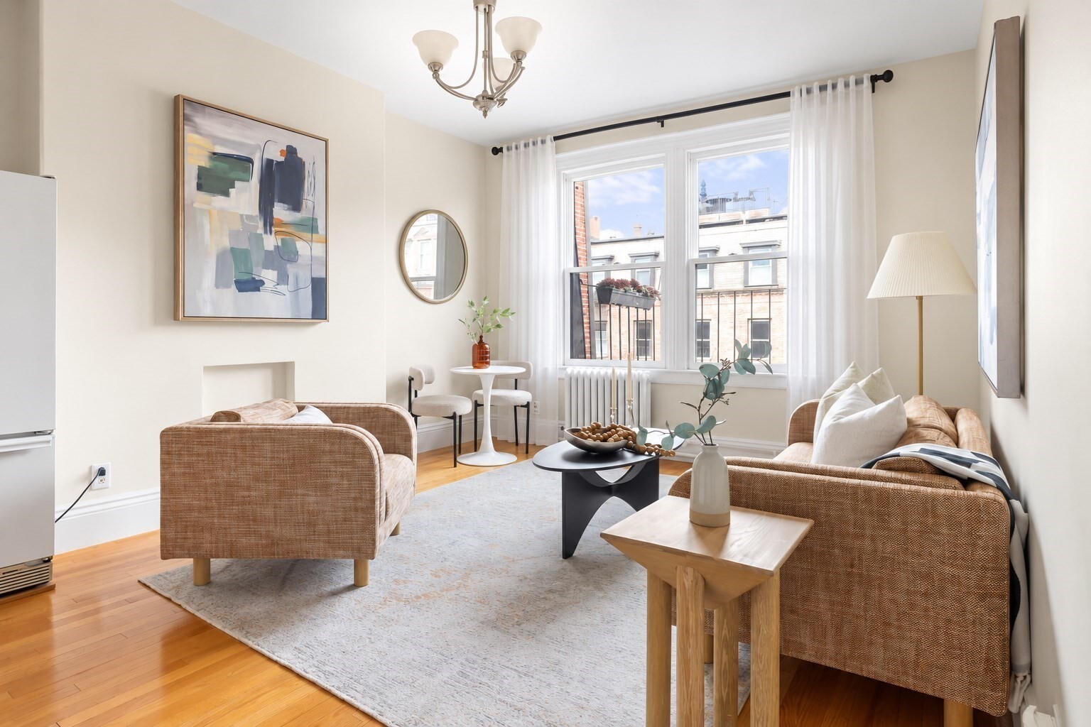 Bathed in natural light, this quintessential Back Bay penthouse residence offers timeless character in an impeccably maintained brownstone with coveted roof rights. Ideally positioned on the sunny side of Marlborough Street, the home welcomes with a gracious entry foyer and coat closet before opening to an expansive living space featuring rich hardwood floors, soaring ceilings, oversized windows, and exceptional scale rarely found in a one-bedroom home. The thoughtfully designed kitchen blends classic style with everyday functionality, while the spacious bedroom offers elegant crown molding and generous closet space. A beautifully appointed marble bath provides a refined retreat, and the convenience of in-unit laundry enhances daily living. Perfectly situated near Newbury Street's renowned boutiques, acclaimed restaurants, the Charles River Esplanade, and the Public Garden, this exceptional residence offers an effortless Back Bay lifestyle in one of Boston's most coveted neighborhoods.