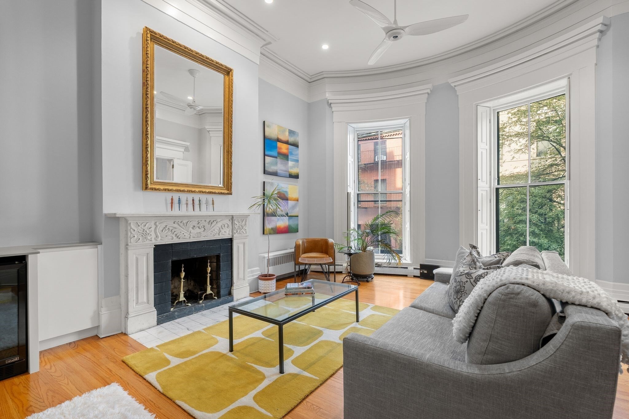 Experience Sophisticated Beacon Hill living in this Elegant Condo. Set in a Charming Brick Residence on a tree-lined street. 30 Hancock Street, Second Floor, 2 Bed/1.5 Bath Home offers many recent improvements. 13-Foot ceilings! Modern Chef's Kitchen w/ Silestone Counters, high-end Gaggenau & Miele Appliances. Charm & Views "meets" Crown molding, Millwork & Detail. Marble Fireplace & floor-to-ceiling windows. Large primary bedroom w/en-suite bath, Marble Mantel & wall of Custom Closets. 2nd Bedroom is a perfect den or library w/custom built-in shelving & closet, fireplace mantel, and Stunning Arched Window. W/D in Unit & Central A/C. PREMIER BOSTON CITY LOCATION, steps to the State House, Mass General Hospital, Red Line T, Whole Foods.