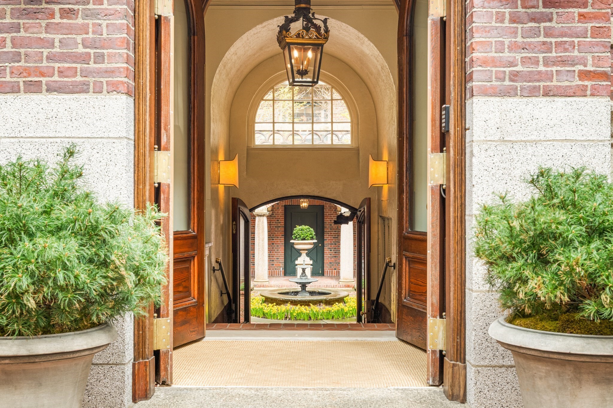 Set within one of Beacon Hill’s most distinguished buildings, 101 Chestnut Street is celebrated for its gracious architecture, elegant courtyard and exceptional service. Unit E offers approximately 2,500 sq. ft. of expansive single-floor living with 2 bedrooms plus a library/office/guest room and 3 full baths. At the heart of the residence is an impressive 22' × 22' living and dining room, offering exceptional scale for both entertaining and everyday living. Desirable corner exposure brings natural light throughout, while the south-facing primary suite features generous proportions, an en suite bath and exceptional closet space. A separate guest wing provides wonderful privacy with a second bedroom, full bath and flexible library/office/guest room with an additional bath. Courtyard views, a well-appointed kitchen, concierge service, beautifully landscaped common roof deck and private storage complete this gracious Beacon Hill residence.