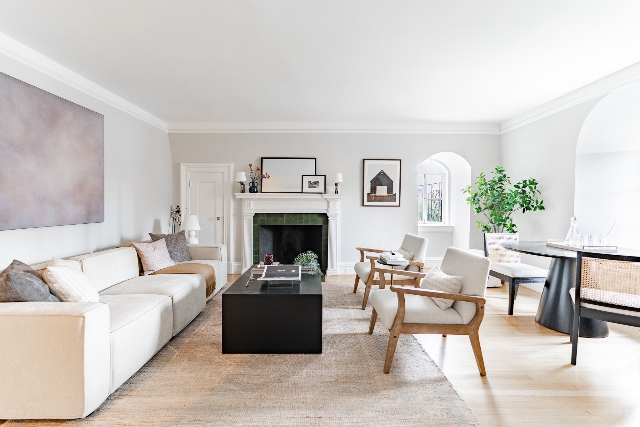 Set in a distinctive elevator building at the corner of Beacon and Fairfield Streets, this oversized 675-square-foot one-bedroom offers the space and character that make Back Bay homes so special. A proper entry leads into the expansive living and dining area, where south-facing arched windows bring in beautiful natural light and frame views across the Back Bay skyline. The windows, decorative fireplace and architectural detailing come together to give the room a warm, elegant feel, with plenty of space to comfortably lounge, dine and entertain. French doors open to a generously sized bedroom with impressive closet space, while the separate kitchen features stone countertops, stainless-steel appliances and ample cabinetry. Solid-wood doors, hardwood floors and classic details add character throughout. With an entrance to the Charles River Esplanade right outside and the shops, restaurants and energy of Newbury Street just a few blocks away, this home offers an unusually spacious layout in one of Back Bay’s most convenient locations.