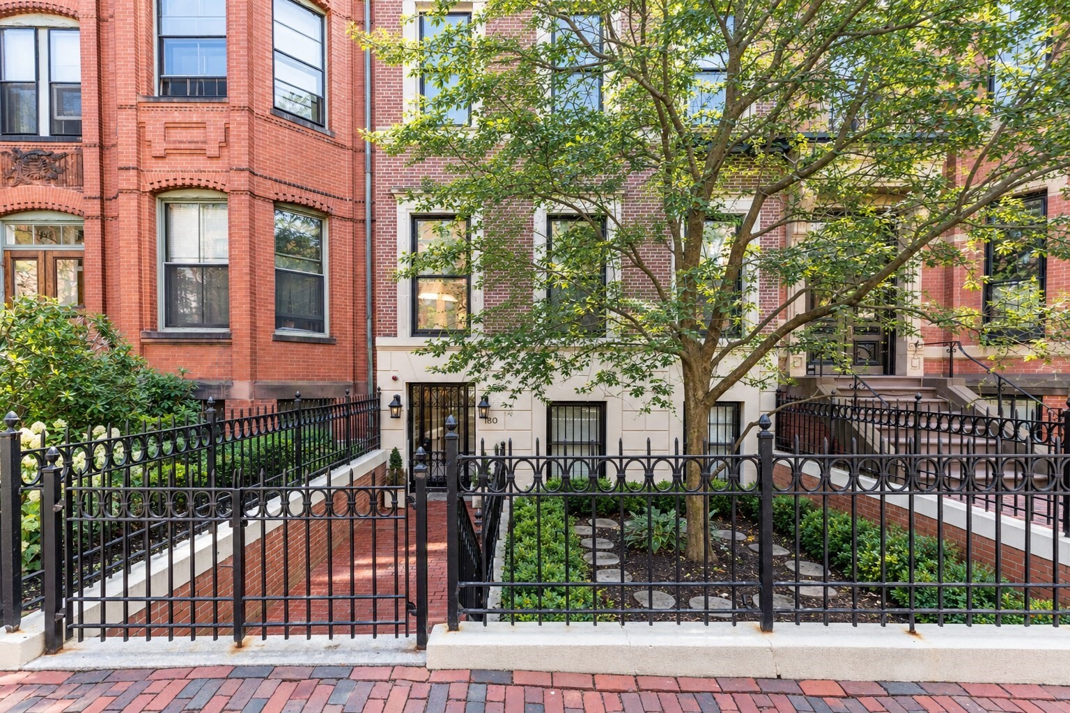 Set within a classic Back Bay townhouse on one of the neighborhood’s most desirable streets, this spacious duplex offers the scale, character and flexibility rarely found in a two-bedroom home. Nearly 2,000 square feet unfold across two levels, with high ceilings, detailed millwork and a striking south-facing bay window bringing beautiful natural light into the main living spaces. A wood-burning fireplace anchors the generous living and dining area, while the eat-in kitchen features custom cabinetry, granite countertops, stainless steel appliances and abundant storage. Two well-proportioned bedrooms each offer renovated en-suite baths, complemented by an additional half bath. An expansive family room with custom built-ins adds tremendous versatility and can easily serve as a media room, home office or potential third bedroom. With its townhouse proportions, flexible layout and coveted Back Bay address, this is a distinctive opportunity to enjoy a remarkably spacious city home. Rental parking is available nearby.
