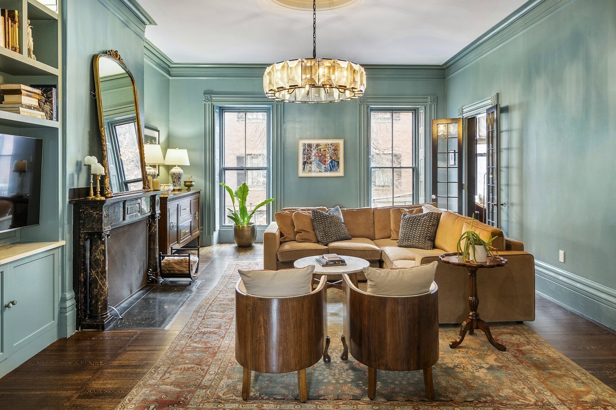 Welcome to 53 Mount Vernon Street, #2 - a masterfully renovated floor through 2+ bedroom home in Beacon Hill. From the moment you step inside, dramatic windows frame picturesque Mount Vernon Street views, while stunning custom millwork and a black marble fireplace set the tone for this exceptional home. The scale and proportions cannot be ignored! The chef’s kitchen is a showstopper, featuring natural stone quartzite countertops, a sleek glass backsplash, curved cabinetry, high-end Waterstone fixtures, and top-of-the-line Wolf and SubZero appliances. The primary suite, completely redesigned with a luxurious en-suite bath, radiant heated floors, and a generous walk-in closet. The oversized second bedroom is bathed in natural light from multiple windows and a skylight, offering a spacious and serene escape. An exquisite office fronts the home allowing ample southern light into the space. And don’t forget the private deck, perfect for morning coffee or evening entertaining.