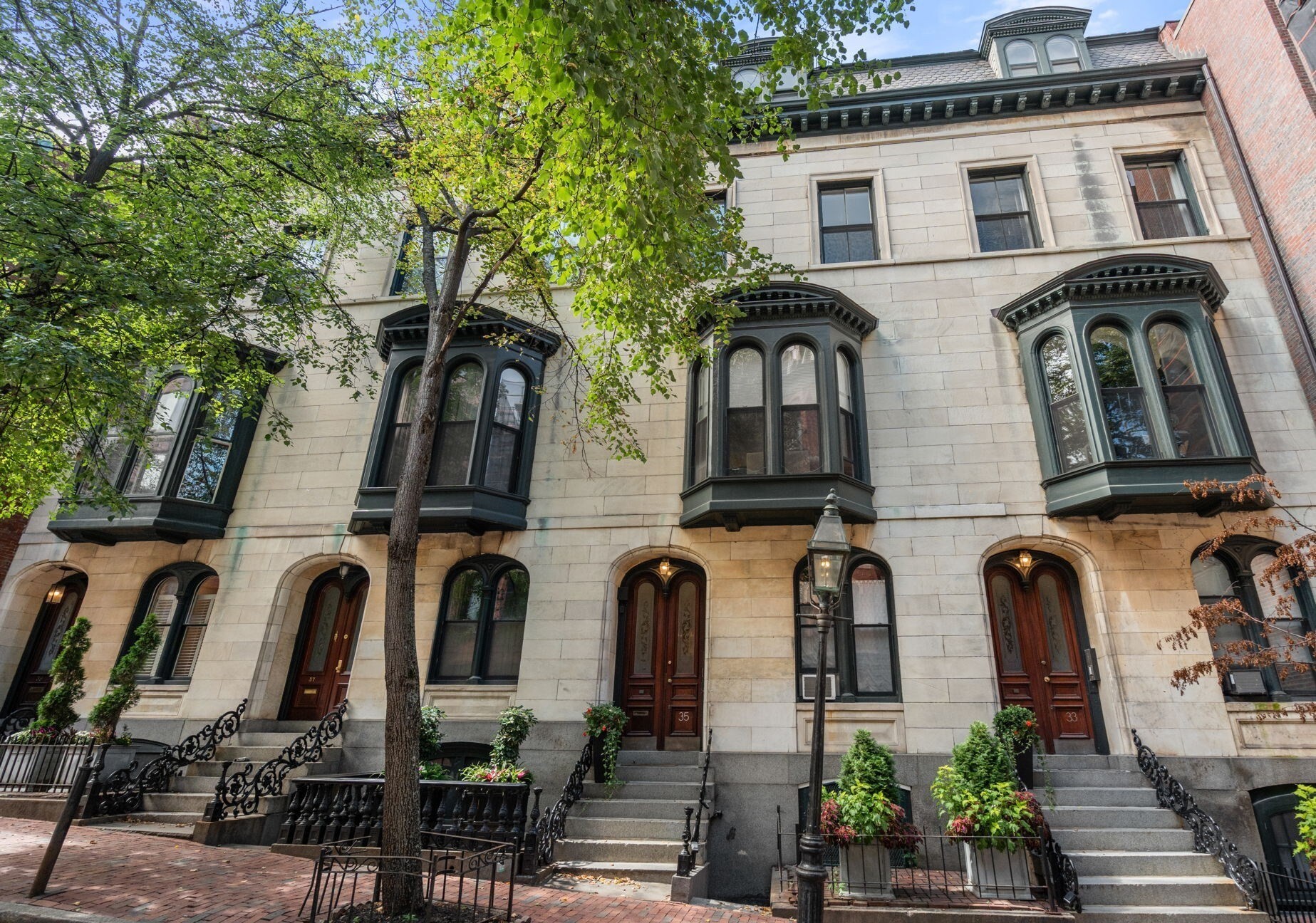 New Listing! Prime Beacon Hill location.  Rare + Distinctive Marble-fronted facade.  Sunny + Sophisticated upper level home with Grand-scale rooms.   Stunning Historic Architectural details paired with Modern finishes.   Giant soaring ceilings, Hardwood floors, Custom millwork, Crown moldings, Marble fireplaces and Chandeliers with ceiling Medallions.   Incredible layout--Perfect for Ease of living + Entertaining.   Open to the living room is a Sleek double sided kitchen with white stone breakfast bar/counters--plenty of work surfaces. Stainless steel appliances. Upper + lower cabinetry. Undermount lighting. Gallery style hallway perfect for your favorite art.  King size bedroom suite has two custom cedar closets with huge dramatic antique wooden doors. Immaculate Spa-inspired bath with steam shower, custom tile work, double medicine cabinets +  large sink vanity. Additional upgrades include Private Laundry,  Air Conditioning, Automatic custom shades in Livingroom,  Lutron Smart lighting + Home water filtration system.   Live in this exciting Beacon Hill neighborhood near quaint shops + outdoor cafes/ destination restaurants, Whole Foods, Mass General, the T,  Boston Common + more all outside your front door.