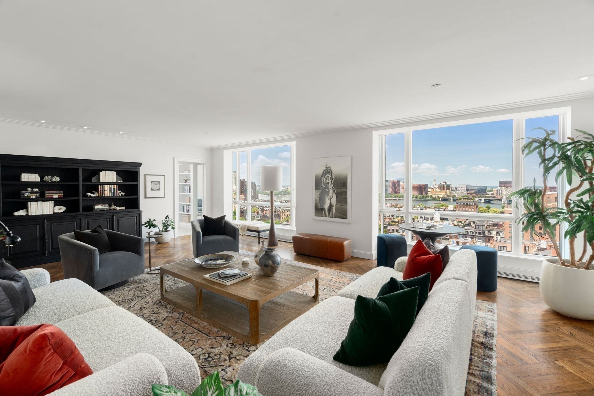 VERY MOTIVATED SELLER and Previously on the market with a Price of $10,595,000, this Large Corner Unit at the Carlton House of Boston is now offered at $8.495,000 and an Incredible Opportunity to purchase a valuable piece of real estate at a great price. Currently a 2 Bedroom Plus Den, this 3657 square foot unit all on one level could be converted to 3 or more Bedrooms. Fantastic Views from Multiple Floor to Ceiling Windows. 15E/F was originally 2 units that were combined so it includes 2 Valet Garage Parking. Located on an upper floor in the building, where ceiling height is higher than the floors below. Very bright with North and West exposures, the views span along the Charles River, Public Garden and a One of Kind view of the Commonwealth Mall. This property could either be moderately renovated (new kitchen and baths), or completely gut renovated. The building offers 24/7 Concierge and Valet, Room Service from the Newbury Hotel and access to the beautiful hotel fitness center.