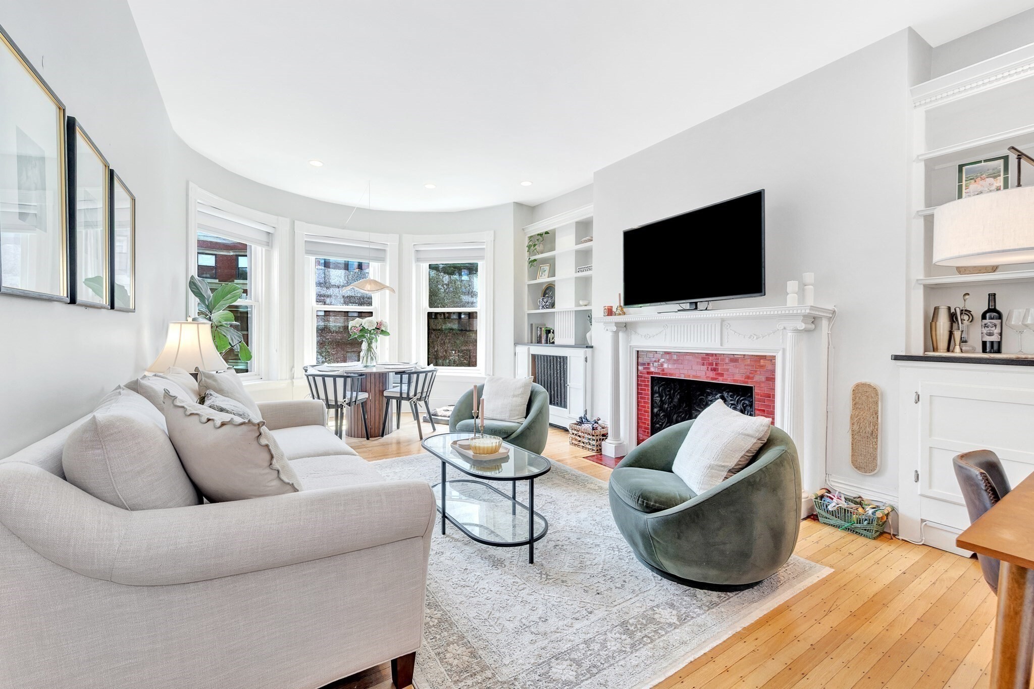 CHARMING BACK BAY 1-BEDROOM | COMMON ROOF DECK | IN-UNIT LAUNDRY. Experience the best of Back Bay living in this charming 1-bedroom, 1-bath residence ideally located near the Charles River, Prudential Center, Fenway, the T, boutique shopping, and exceptional dining. The sun-filled living room features elegant bay windows, classic built-in shelving, and a beautiful fireplace, creating a warm and inviting space with timeless Boston character. The kitchen offers custom cabinetry, granite countertops, and stainless steel appliances, while hardwood floors run throughout the home. The spacious bedroom provides a generous walk-in closet, with additional storage in the hallway and bedroom. An in-unit washer/dryer adds everyday convenience. Enjoy the ultimate city escape from the common roof deck, offering beautiful views of the Charles River and Boston skyline. A wonderful opportunity to enjoy classic Back Bay charm with modern conveniences in one of Boston’s most desirable neighborhoods.