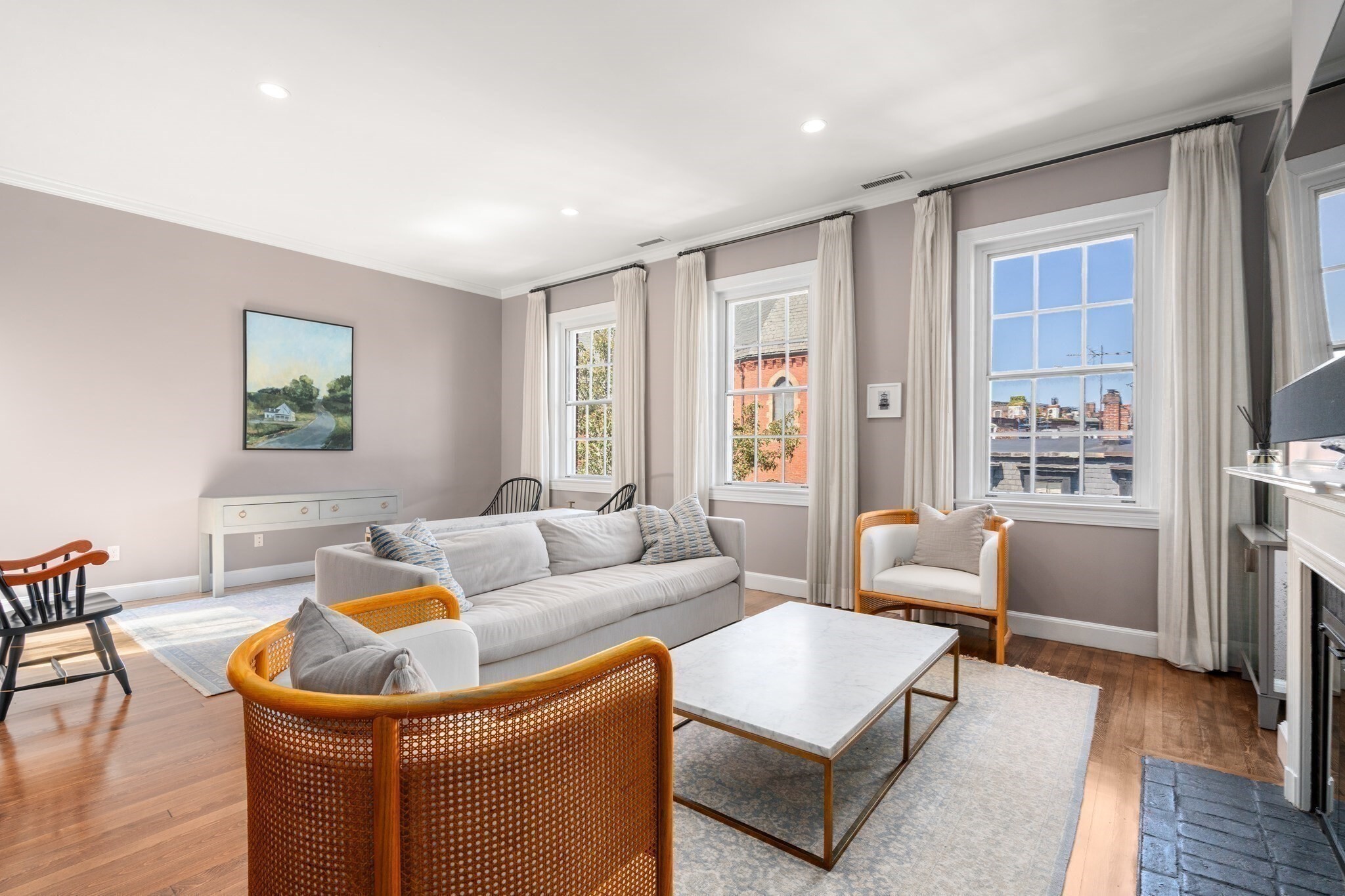 PENTHOUSE ON FLAT OF THE HILL. This exquisitely renovated, front-facing penthouse offers two bedrooms two full baths and exceptional private outdoor space.  The oversized living room overlooks picturesque Mount Vernon Street and features a fireplace, hardwood floors, and two distinct seating areas.  Living space opens onto a gracious dining room.  Eat-in-kitchen with high-end Thermador appliances, custom cabinetry and timeless finishes.  Adjacent to the kitchen is a balcony perfect for morning coffee. Thoughtfully separated from the entertaining spaces, the bedroom area offers custom closets, abundant storage, in-unit laundry and a luxurious bathroom with double vanities. A full staircase leads to an expansive 600+ sq. ft. private roof deck equipped with a gas grill and ample room for both lounging and dining.  Professionally managed with active trustee involvement, this is an exceptional Beacon Hill penthouse in one of the neighborhood's most coveted locations.
