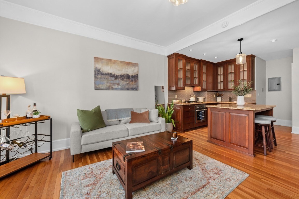 In Back Bay, where parking is scarce, this beautiful one-bedroom home on iconic Marlborough Street comes with its own assigned tandem parking space. Perched on the sunny top floor, this south-facing unit offers a spacious, open layout that elegantly blends classic architectural detail with a renovated kitchen and bath. The large, open kitchen features cherry cabinetry, stainless steel appliances, a Sub-Zero under-counter refrigerator, a breakfast bar, and granite counter tops — ideal for cooking and entertaining. The spacious living room is filled with light and frames sweeping views of the Back Bay skyline and the Prudential Tower. Additional features include a walk-in bedroom closet, extra storage, high ceilings, hardwood floors throughout, and common laundry.  Just steps from the shops and restaurants of Newbury Street, the Charles River Esplanade, and Back Bay's public transportation. This address scores a 98 Walk Score (Walker's Paradise), 99 Transit Score (Rider's Paradise), and 88 Bike Score (Very Bikeable) for daily errands, commuting, making city life effortless!  Open House - Sunday Septermber 27,2026 - 1230 pm - 130 pm.