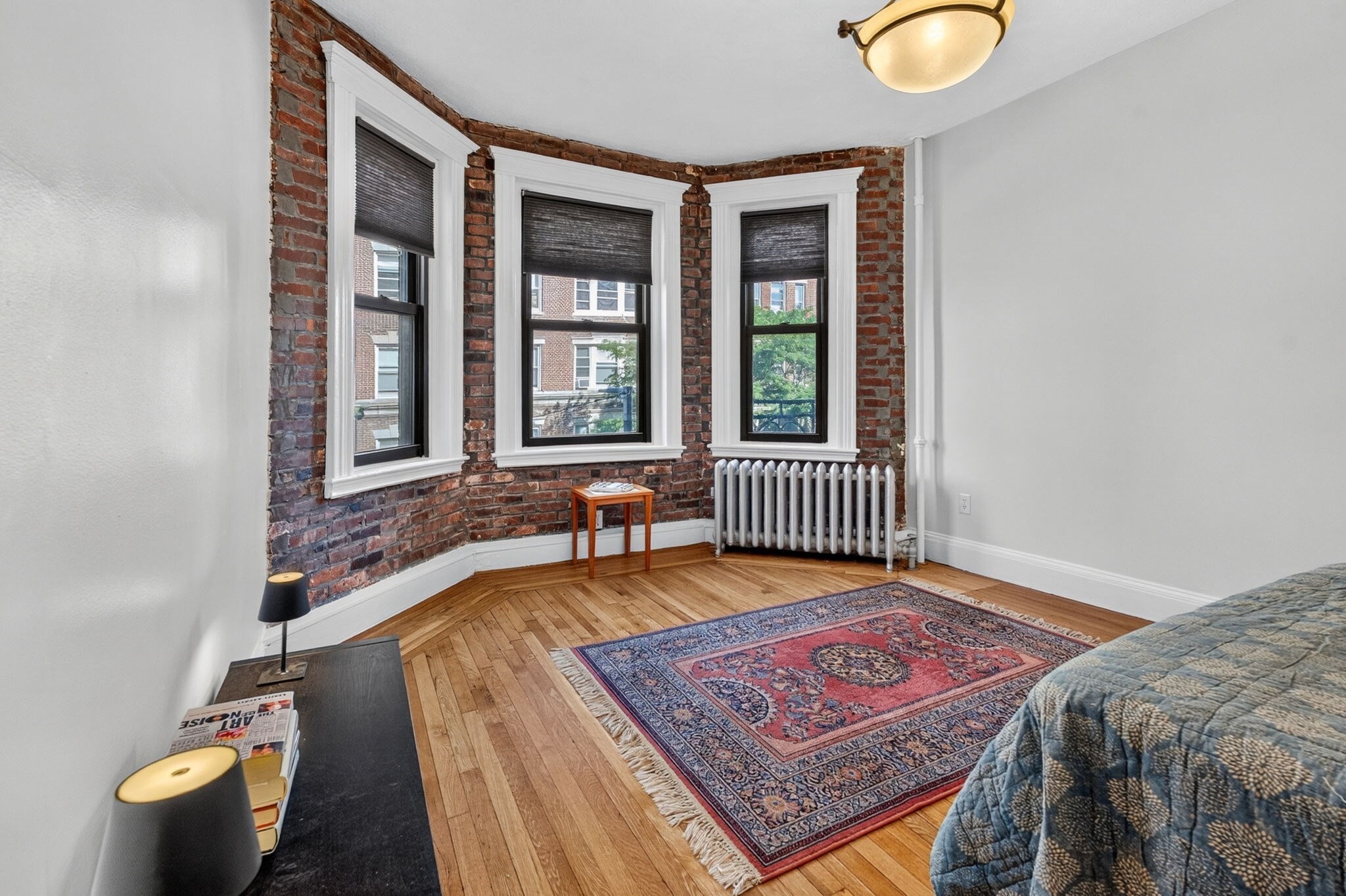 Classic Fenway character and an outstanding location come together at 107 Jersey Street #5. This bright 395 SF studio offers far more personality than the typical small condo, with a spacious main living area highlighted by a beautiful bay of windows, exposed brick, hardwood floors and excellent natural light. The layout provides plenty of room to create distinct sleeping and living areas, while a separate windowed kitchen keeps the main room feeling like living space rather than a kitchen with a bed in it. Full tiled bath and laundry in the building. Set in an attractive, professionally managed brick building in the heart of Fenway, the location offers exceptional access to the Longwood Medical Area, area colleges and universities, public transportation, restaurants, shopping, cultural attractions and everything Boston has to offer. An appealing option for an owner-occupant, medical or graduate student, pied-à-terre buyer, or investor looking for a well-located Boston property